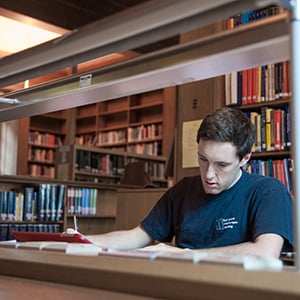 student working in a library