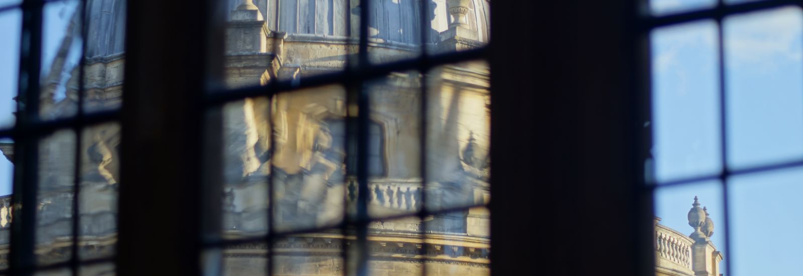 A view of the Radcliffe Camera through a window