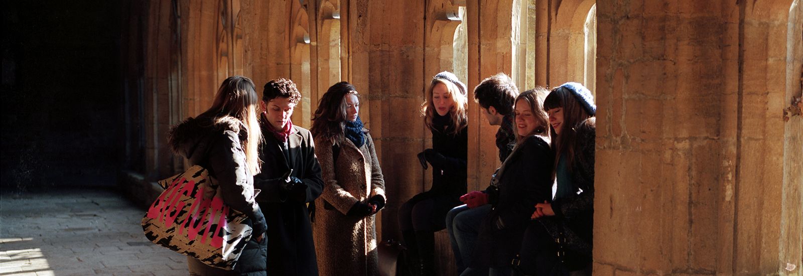 A group of students in cloisters