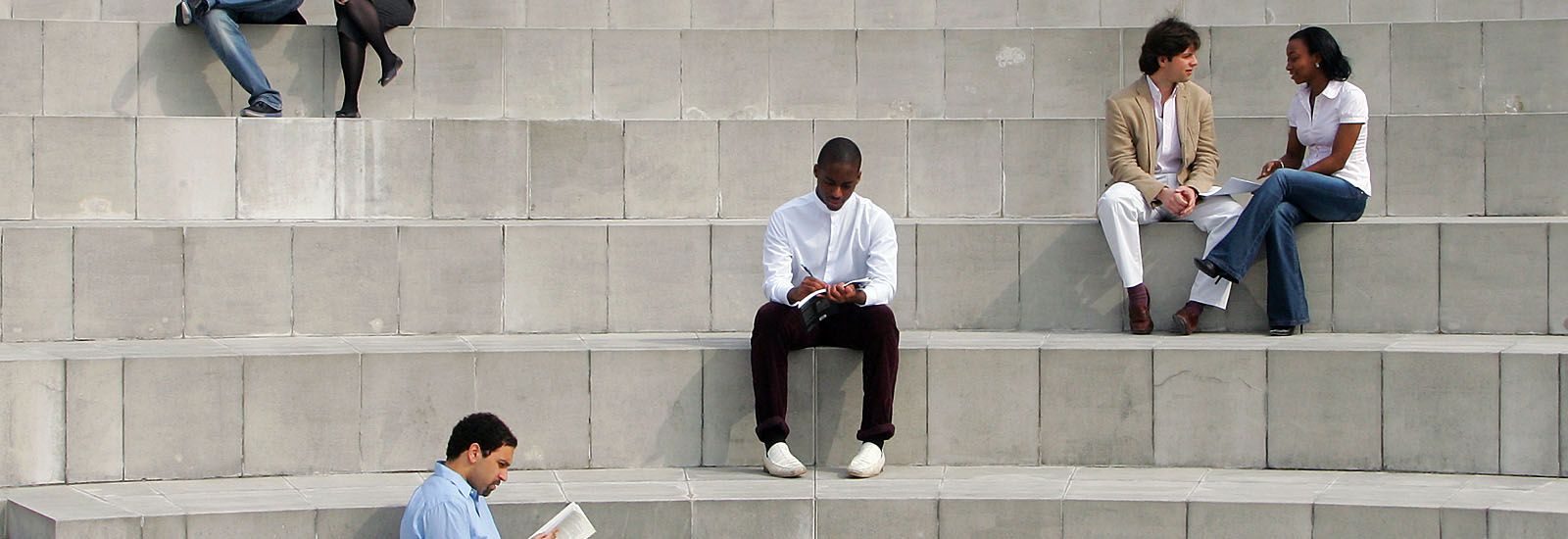 Students sitting on concrete steps