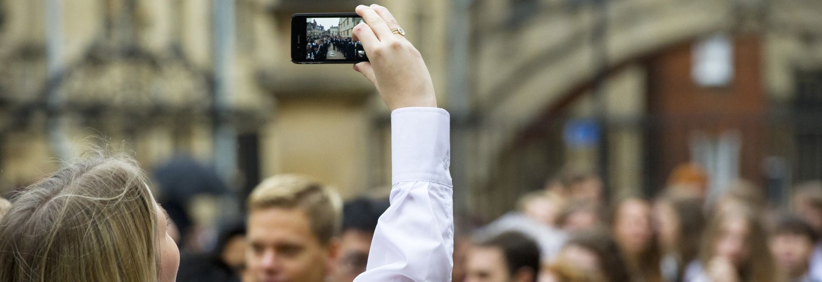 Student takes photo of peers Students takes photo