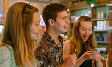 Three students in a shop