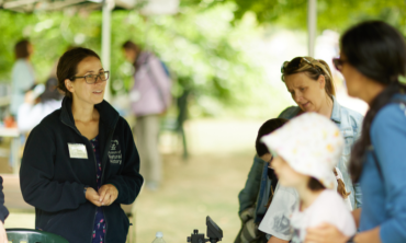 a female guide talking to members of the public