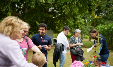 a group of people socialising outside