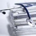 Photograph of a stethoscope and doctor's notes