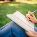 woman writing in journal